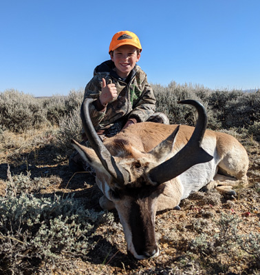 Daxton with a very nice buck big antelope buck i went hunting antelope