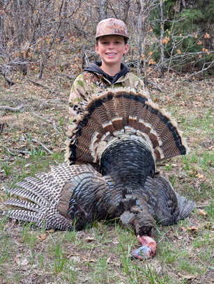 Daxton with his tom mature gobbler tom turkey