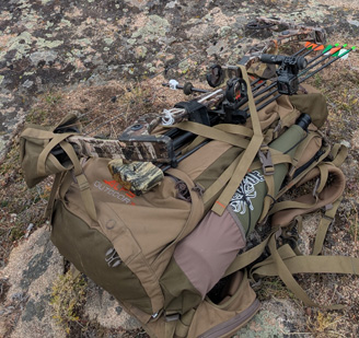 Backpack, bow, grunt tube Backpack, bow, elk grunt tube