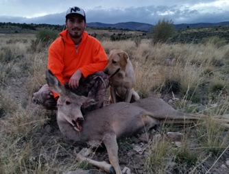 Woodie broke out of his kennel and met us on the mountain hunting antlerless deer, doe mule deer
