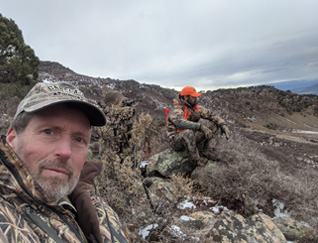 Saw decent buck overlooking the valley below Colorado deer hunt overlooking valley